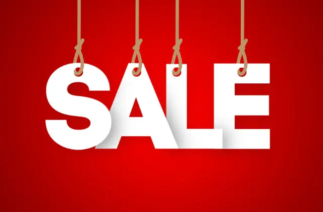 Czerwone tło z białym napisem SPRZEDAŻ